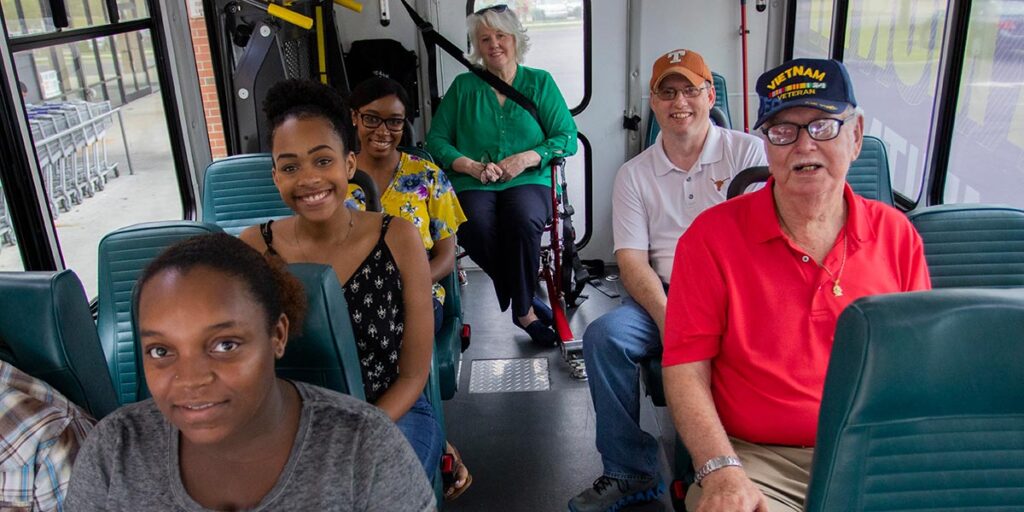 Group of people on commuter bus
